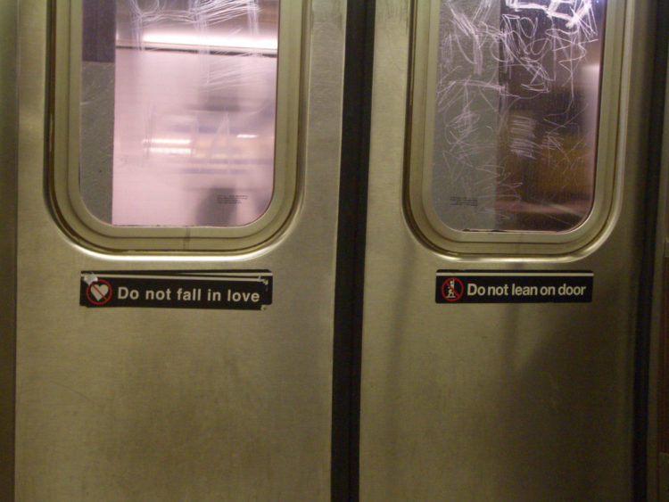 "do not fall in love" sticker on door